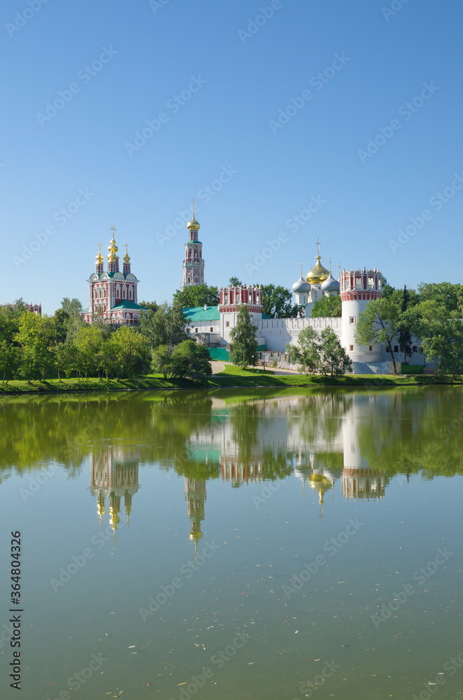 Novodevichy monastery on a Sunny summer day. View from the Big Novodevichy pond. Moscow, Russia