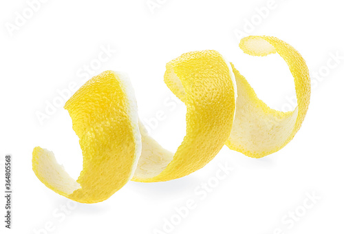 Peel of fresh ripe lemon isolated on a white background. Lemon twist. Lemon skin. Citron.