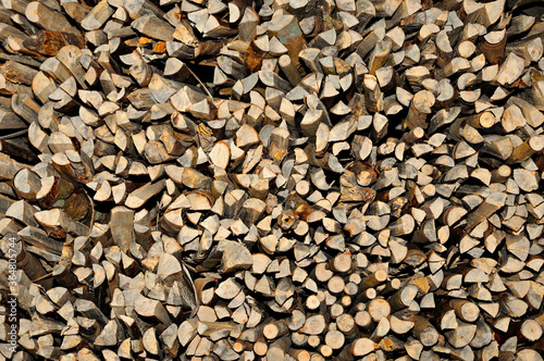 A pile of firewood  wooden texture background