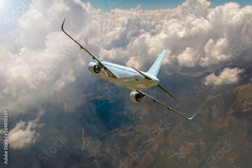 Fototapeta Naklejka Na Ścianę i Meble -  Passenger airplane in the clouds.
