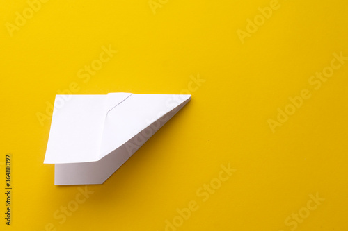 assembly procedure of a paper white airplane. Origami.