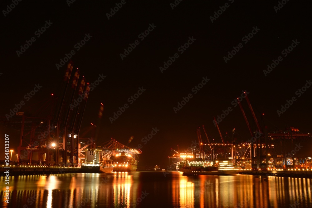 container ships in port of Hamburg during night