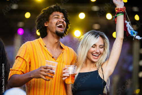 Happy couple, friends having fun together and drinking in the city