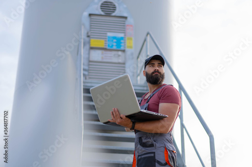 Portrait of worker using his laptop. 