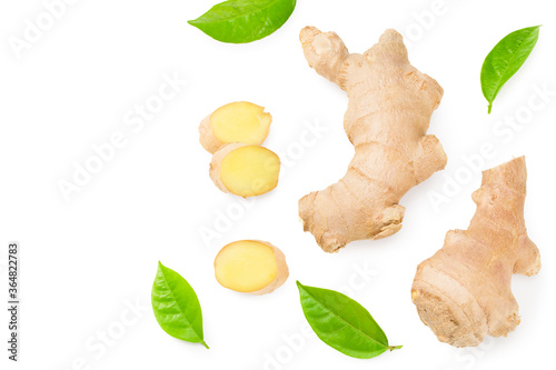ginger roots with slices and green leaves isolated on white background. Top view