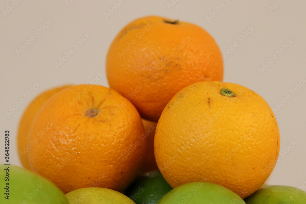 Beautiful lemons and oranges arranged on a table. A fruit rich in vitamin c. Beautiful lemons and oranges arranged on a table. A fruit rich in vitamin c.
