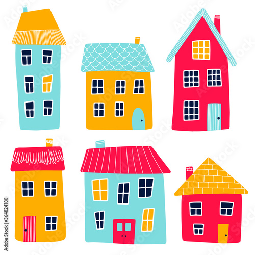 Obraz na plátně Vector illustration of multi-colored cartoon primitive houses isolated on a white background