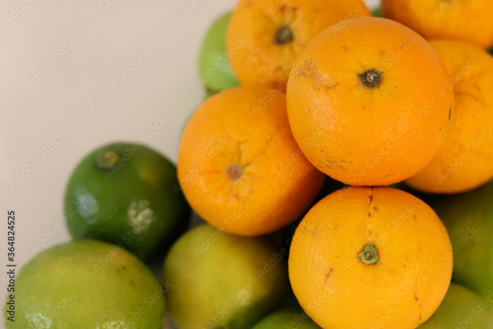 Beautiful lemons and oranges arranged on a table. A fruit rich in vitamin c. Beautiful lemons and oranges arranged on a table. A fruit rich in vitamin c.
