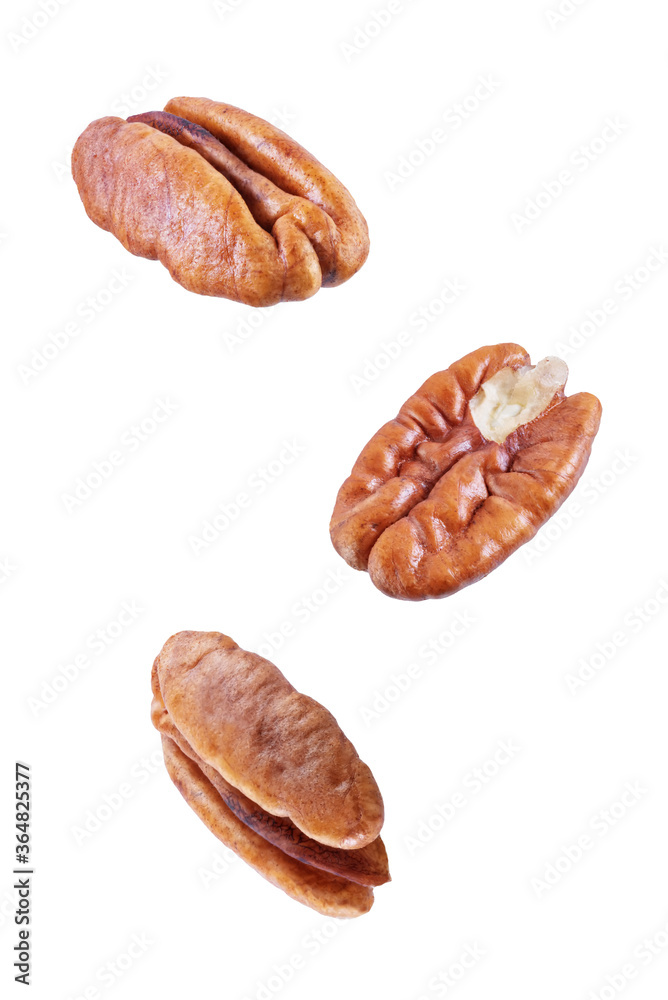 Pecan nuts on a white isolated background Pecan nuts on a white isolated background