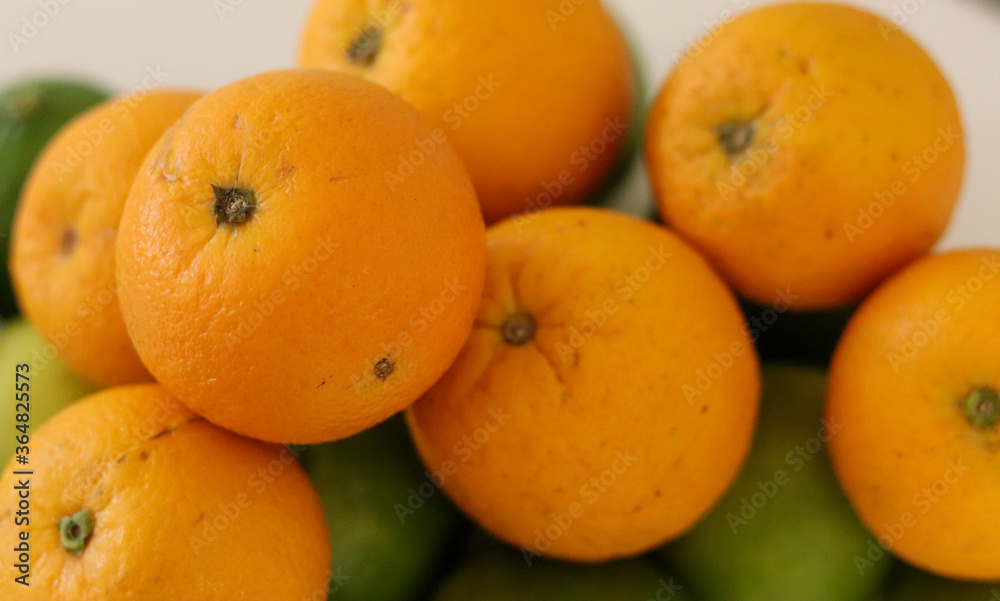 Beautiful lemons and oranges arranged on a table. A fruit rich in vitamin c.