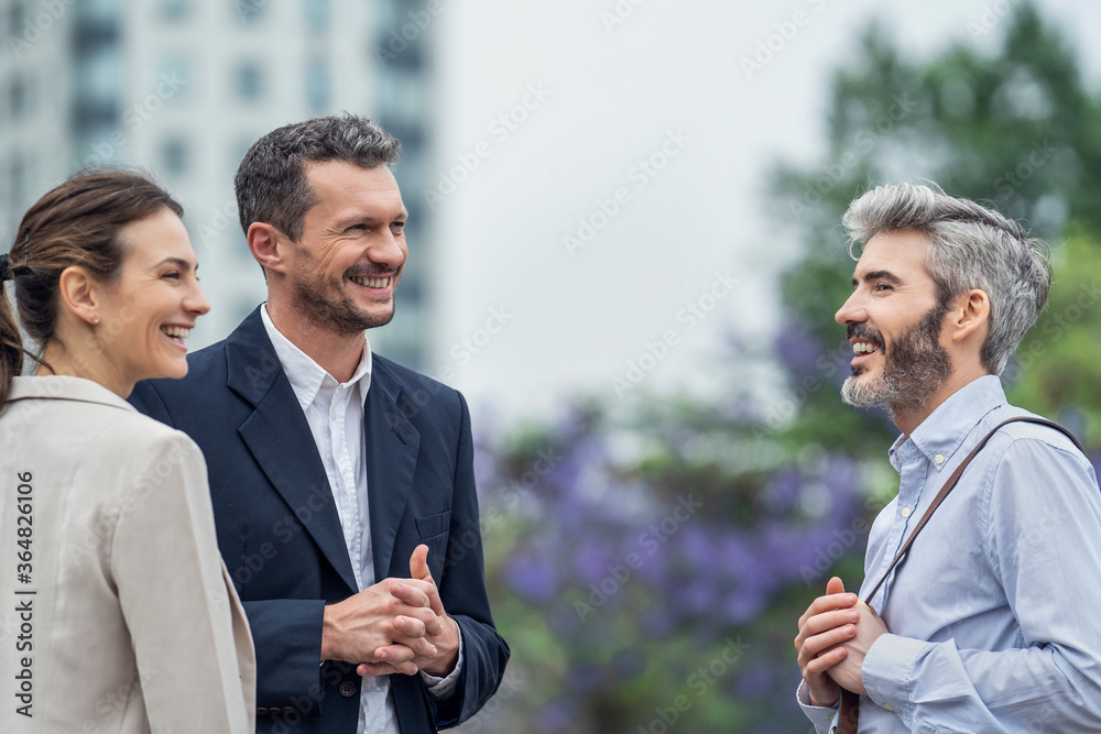 Businesspeople talking in public park Businesspeople talking in public park