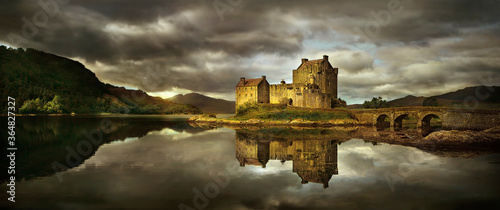 United Kingdom, Scotland, Medieval castle reflecting in lake