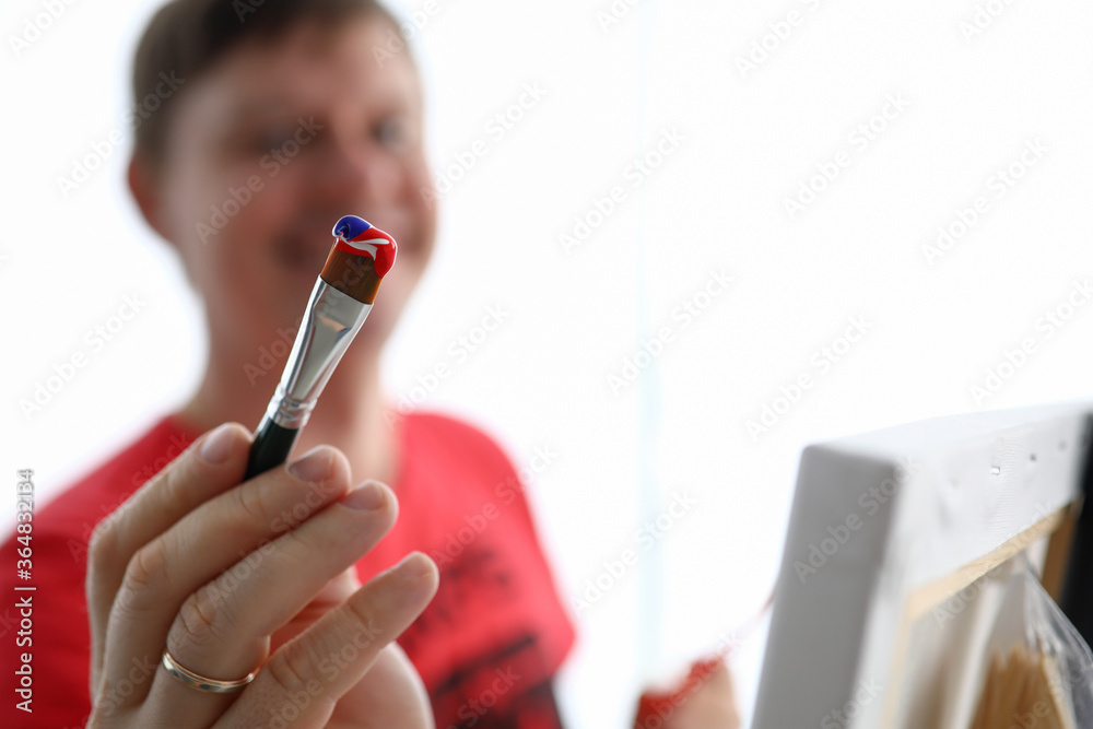 Cheerful painter creating picture Cheerful painter creating picture