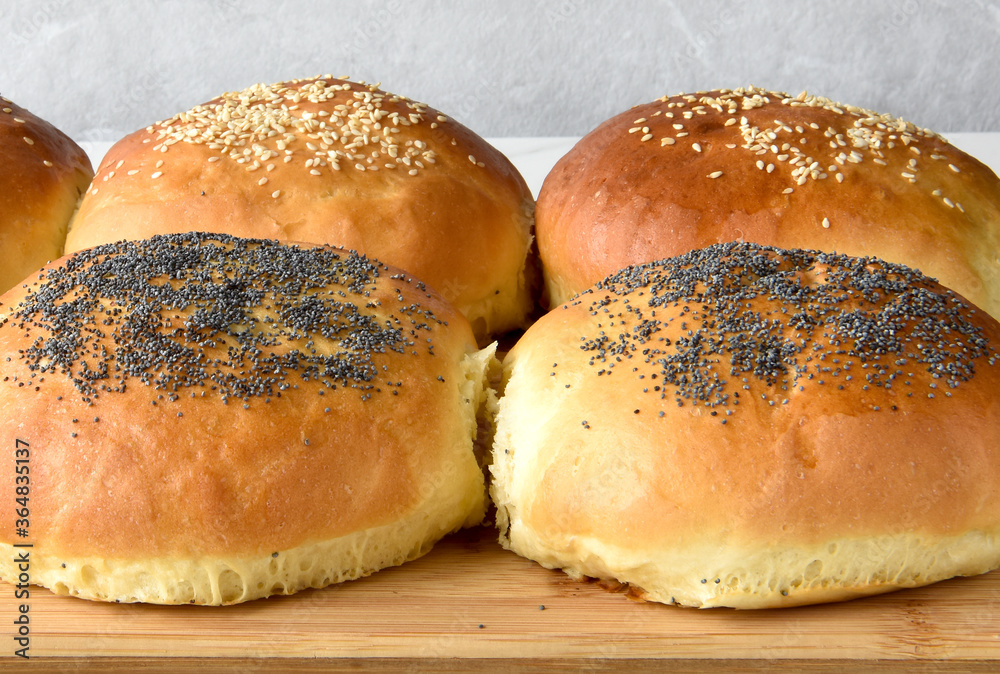 hot homemade buns with sesame and poppy seeds