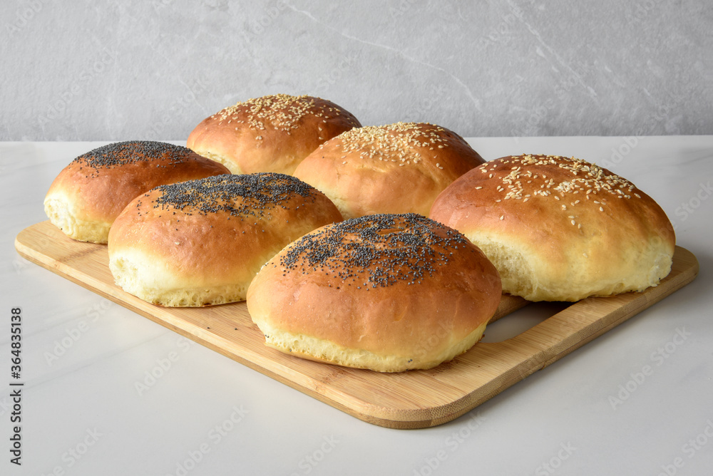 hot homemade buns with sesame and poppy seeds hot homemade buns with sesame and poppy seeds