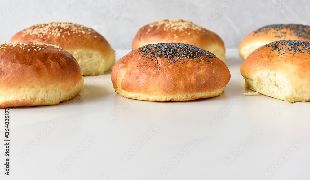 hot homemade buns with sesame and poppy seeds
