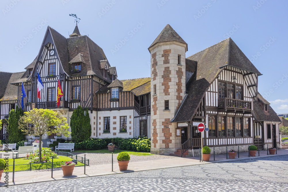 Town Hall (Mairie) in Deauville decorated with flags and flowers. Town