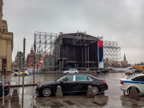 The process of assembling (disassembling) the scene in the city center for the next city holiday. Against the background of Maybach. photo