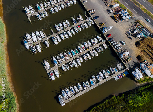 Panoramic high angle drone view of the beautiful marina in beach boats piers