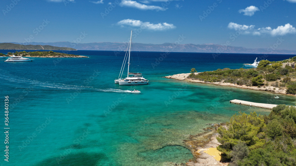 Aerial drone photo of Chinitsa bay a popular anchorage crystal clear turquoise sea bay for yachts and sail boats next to Porto Heli, Saronic gulf, Greece