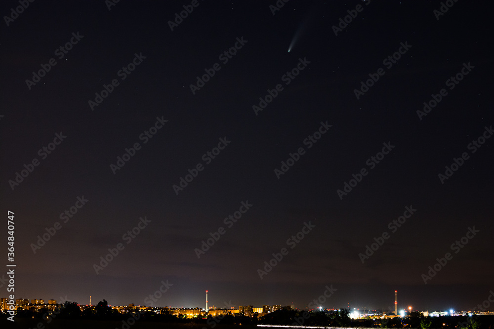 Retrograde comet with a near-parabolic orbit C/2020 F3 (NEOWISE) above Prague in Czech republic