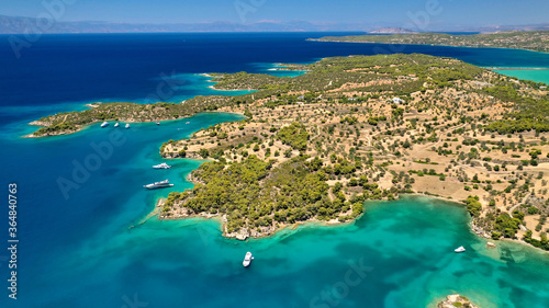 Aerial drone photo of beautiful fjord landscape forming turquoise beaches in small vegetated coves in Porto Heli a popular anchorage for yachts and sail boats, Argolida, Greece © aerial-drone