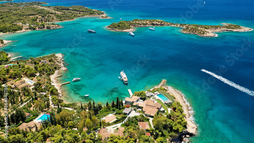 Aerial drone photo of Hinitsa bay a popular anchorage crystal clear turquoise sea bay for yachts and sailboats next to Porto Heli, Saronic gulf, Greece