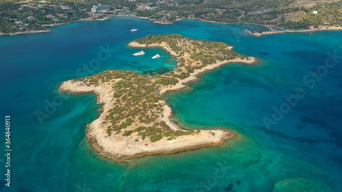 Aerial drone photo of Hinitsa bay a popular anchorage crystal clear turquoise sea bay for yachts and sailboats next to Porto Heli, Saronic gulf, Greece