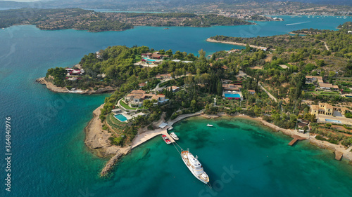 Aerial drone photo of Hinitsa bay a popular anchorage crystal clear turquoise sea bay for yachts and sail boats next to Porto Heli, Saronic gulf, Greece photo