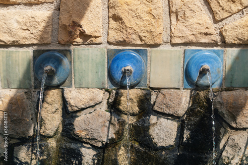 Fountain with clear fresh water at Polop de Marina, Costa Blanca, Spain photo