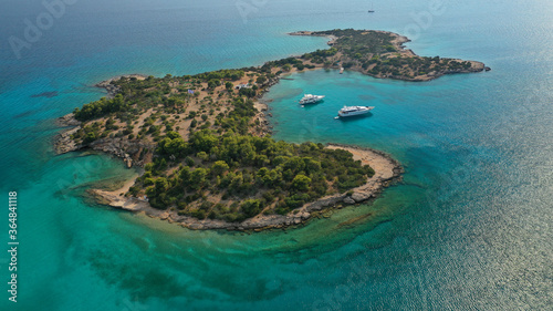 Aerial drone photo of Hinitsa bay a popular anchorage crystal clear turquoise sea bay for yachts and sailboats next to Porto Heli, Saronic gulf, Greece