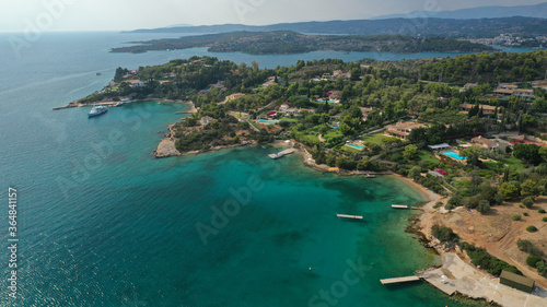Aerial drone photo of Hinitsa bay a popular anchorage crystal clear turquoise sea bay for yachts and sailboats next to Porto Heli, Saronic gulf, Greece © aerial-drone