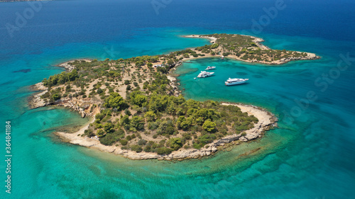 Aerial drone photo of Hinitsa bay a popular anchorage crystal clear turquoise sea bay for yachts and sailboats next to Porto Heli, Saronic gulf, Greece