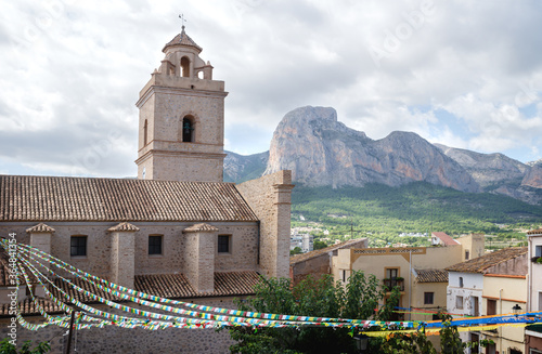 Detail of the church of Polop de Marina with mountainrange, Costa Blanca, Spain photo