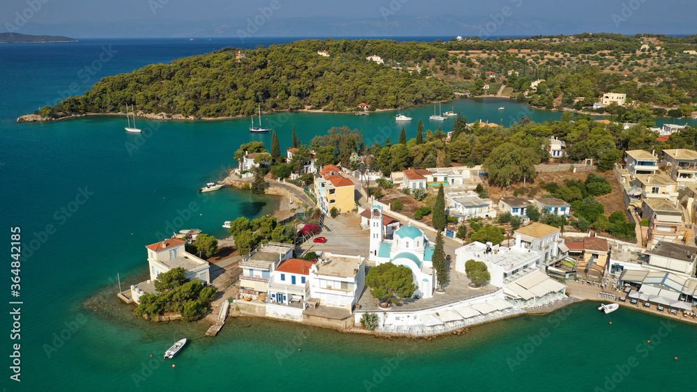 Aerial drone photo of Hinitsa bay a popular anchorage crystal clear turquoise sea bay for yachts and sail boats next to Porto Heli, Saronic gulf, Greece