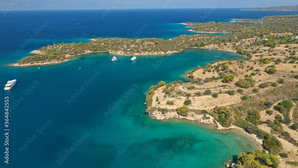 Aerial drone photo of beautiful fjord landscape forming turquoise beaches in small vegetated coves in Porto Heli a popular anchorage for yachts and sail boats, Argolida, Greece