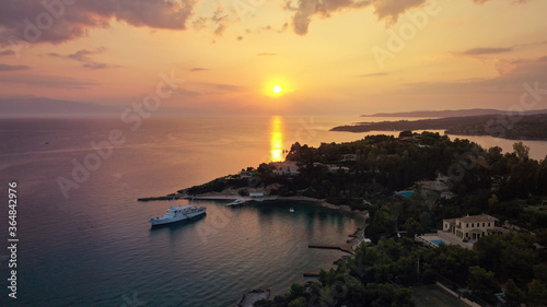 Aerial drone panoramic photo of famous fjord seaside village and bay of Porto Heli in the heart of Argolida prefecture at sunset, Peloponnese, Greece photo