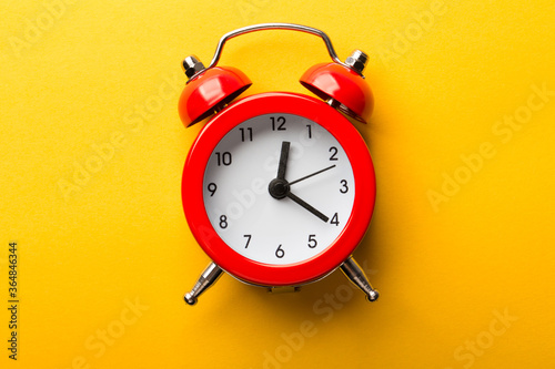 Clock Isolated On Yellow Background