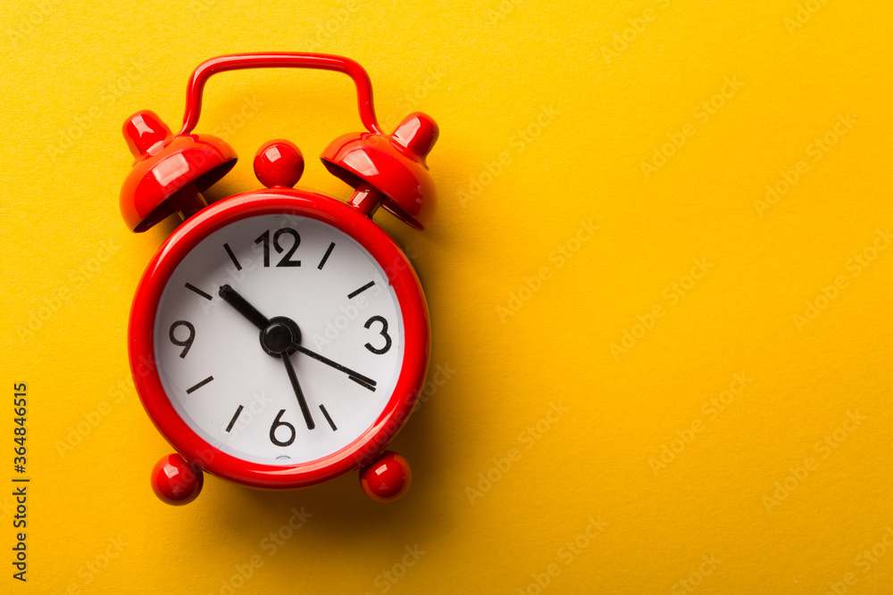 Clock Isolated On Yellow Background Clock Isolated On Yellow Background