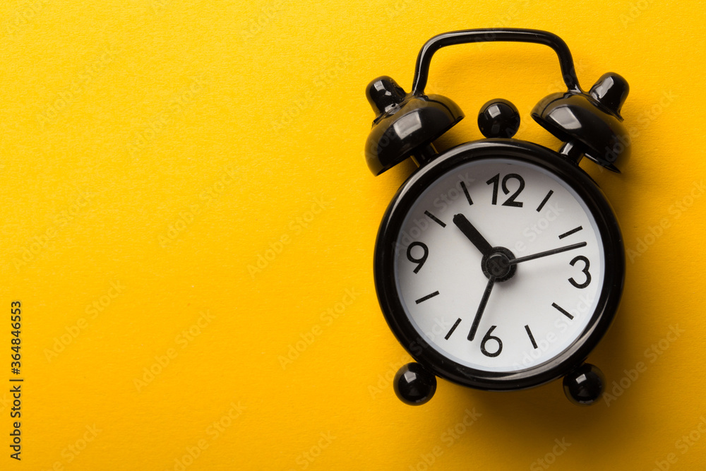 Clock Isolated On Yellow Background Clock Isolated On Yellow Background