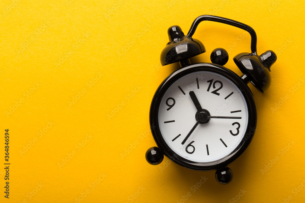 Clock Isolated On Yellow Background Clock Isolated On Yellow Background