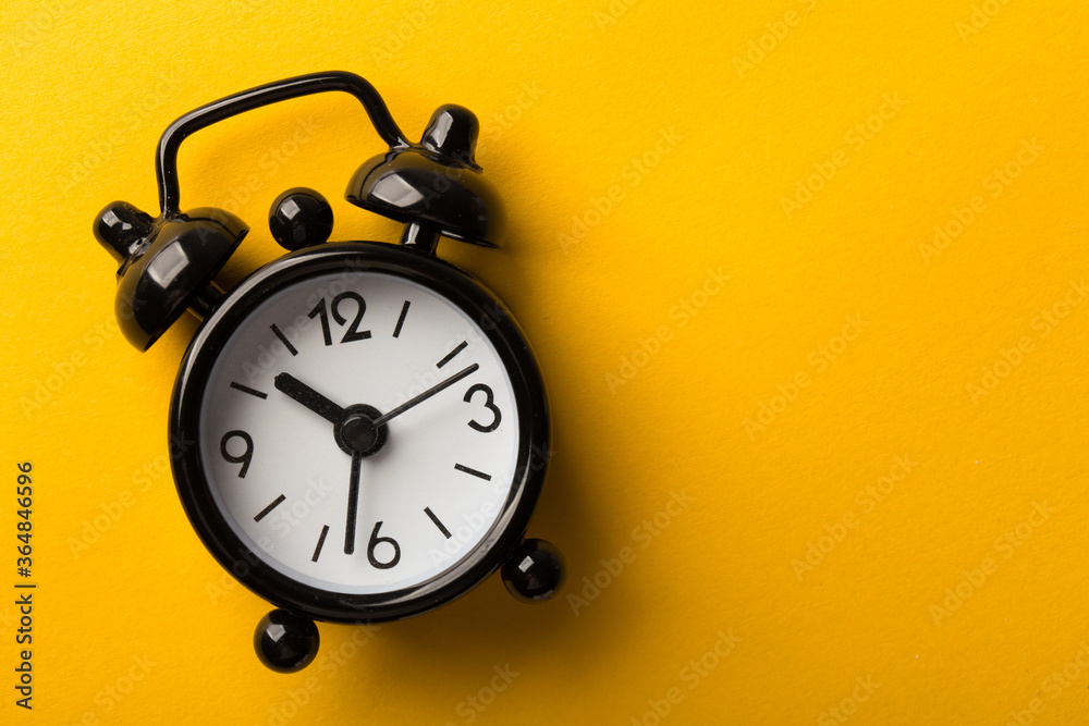 Clock Isolated On Yellow Background Clock Isolated On Yellow Background