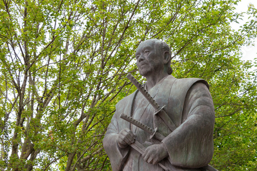 Tsukahara Bokuden Statue in Kashima, Ibaraki Prefecture, Japan. Tsukahara Bokuden (1489 - 1571) was a famous master swordsman of the early Sengoku period. photo