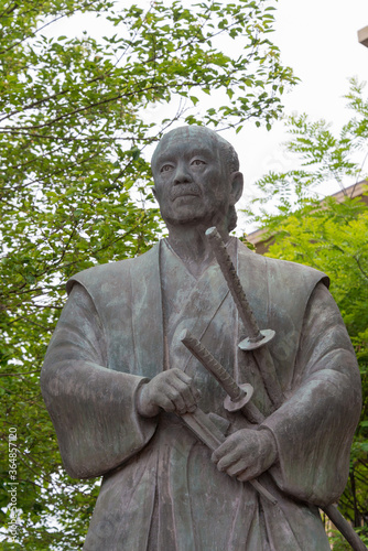 Tsukahara Bokuden Statue in Kashima, Ibaraki Prefecture, Japan. Tsukahara Bokuden (1489 - 1571) was a famous master swordsman of the early Sengoku period. photo