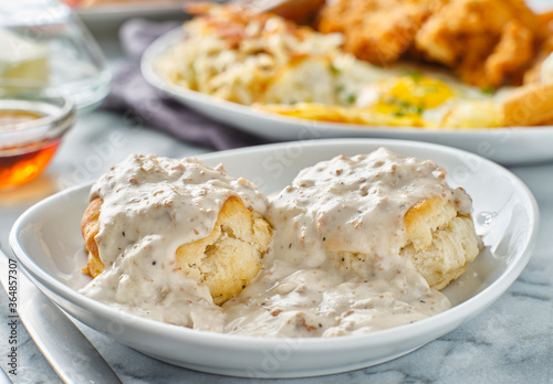 biscuits and gravy with sausage on plate
