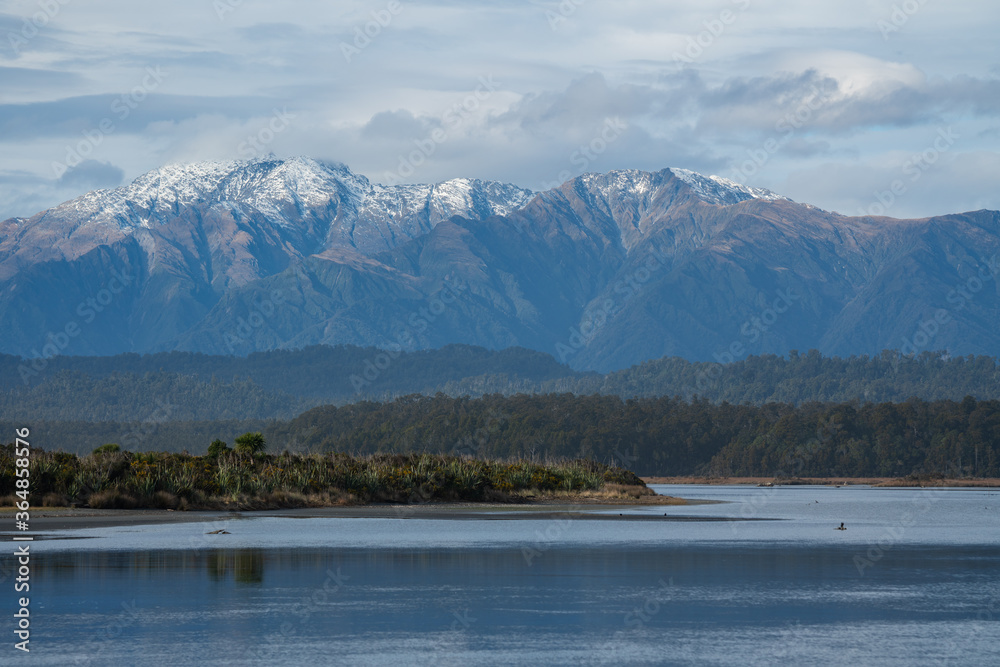 Okarito on the West Coast of New Zealand with mountains in the background
