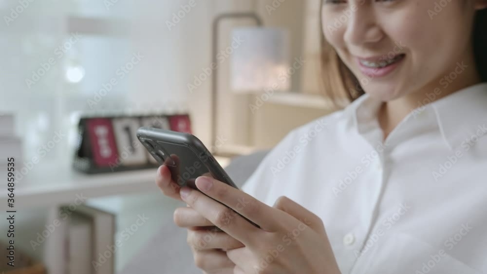 Young Asian woman holding a smartphone and using online social on lifestyle. Young Asian woman holding a smartphone and using online social on lifestyle.