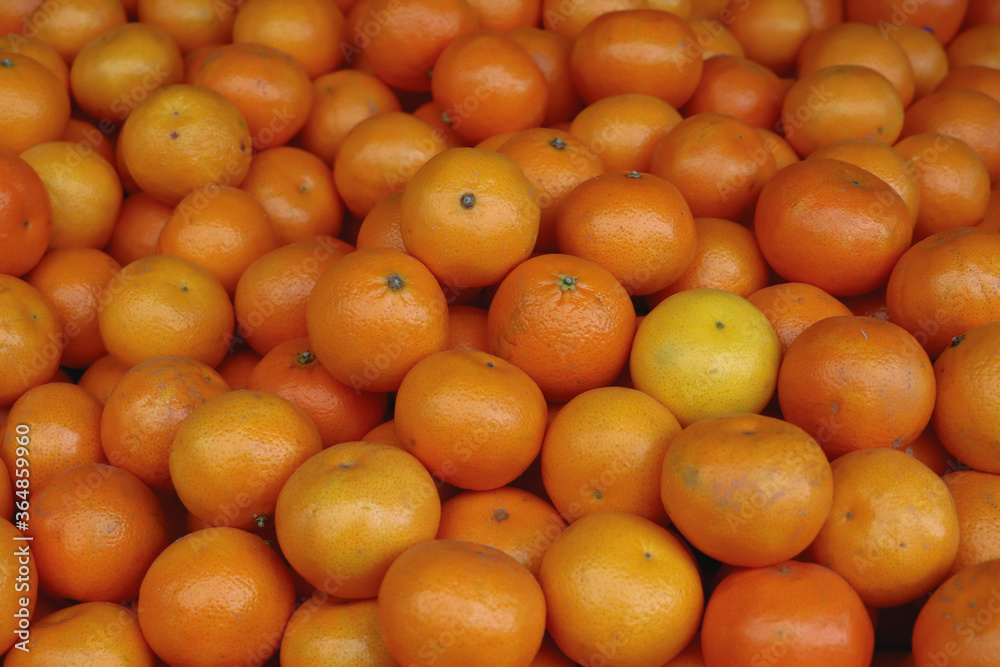 Bunch of small fresh oranges  