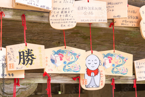 Traditional wooden prayer tablet (Ema) at Benkeido Hall at Chusonji Temple in Hiraizumi, Iwate, Japan. photo