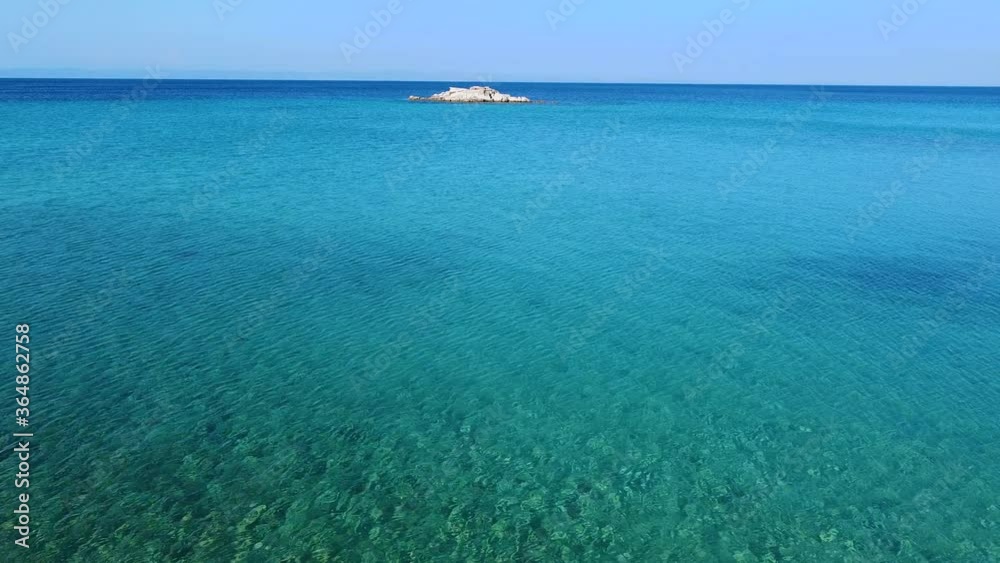 Little island in beautiful turquoise sea. Aerial view Little island in beautiful turquoise sea. Aerial view